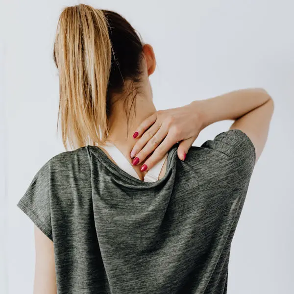 Woman touching her neck